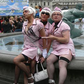 Three homosexual men dressed as women